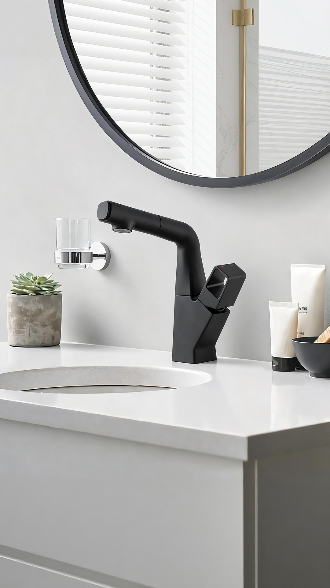 Close-up of matte black basin mixer handle with hot and cold indicator dots